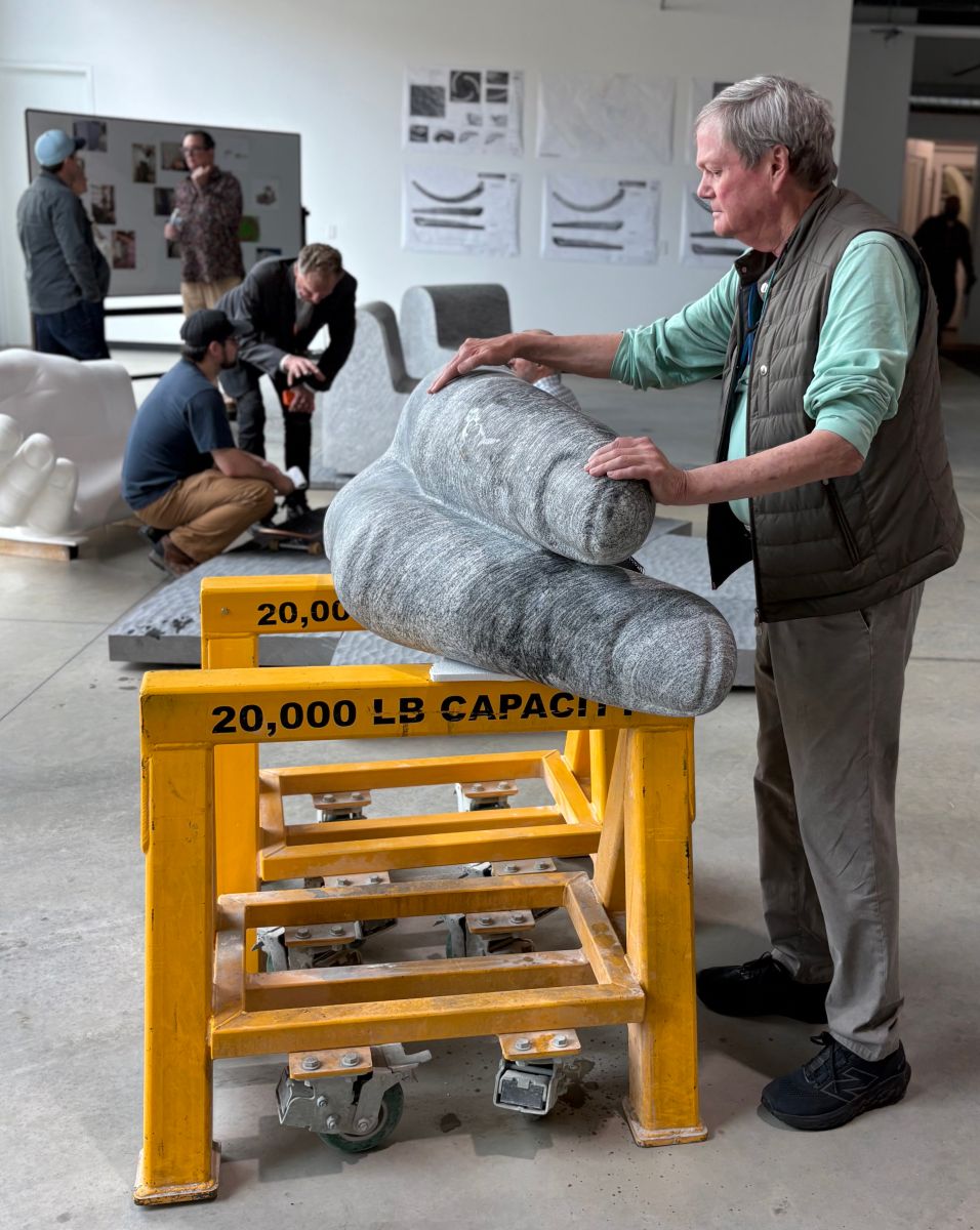 An image of designer Larry Kirkland evaluating a mockup of the finger shapes carved by Quarra Stone Co.